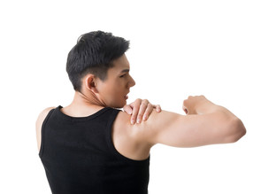 man in black singlet holding deltoid muscle having shoulder pain